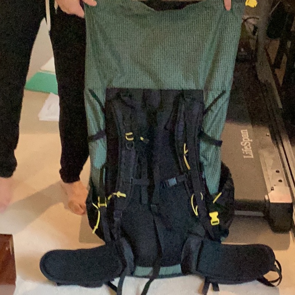 Approximately 65 L UL catalyst, backpack in black and green checkered